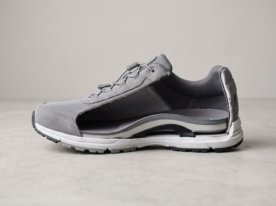 Cutaway walking shoe showing a built-in arch support footbed