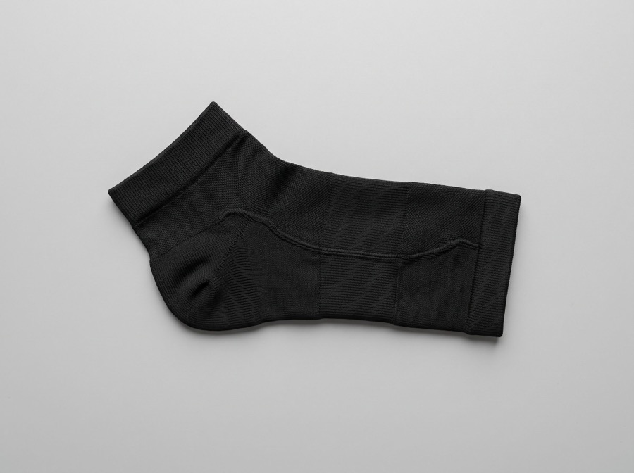 Black compression arch support sleeve for the foot and ankle